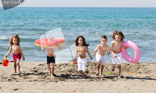 Image of child group have fun and play with beach toys
