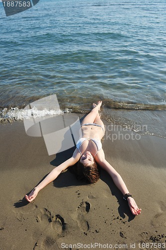 Image of young woman relax  on beach