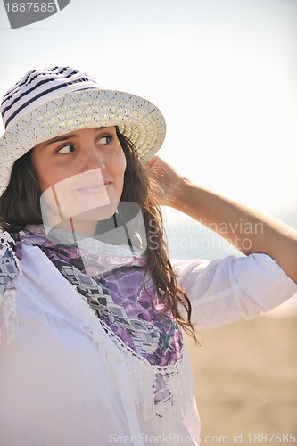 Image of happy young woman on beach