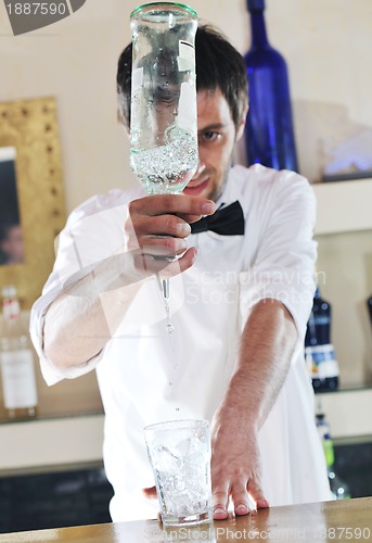 Image of pro barman prepare coctail drink on party