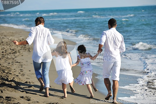 Image of happy young  family have fun on beach