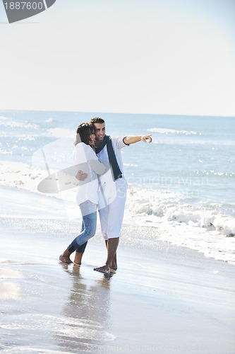 Image of happy young couple have fun at beautiful beach