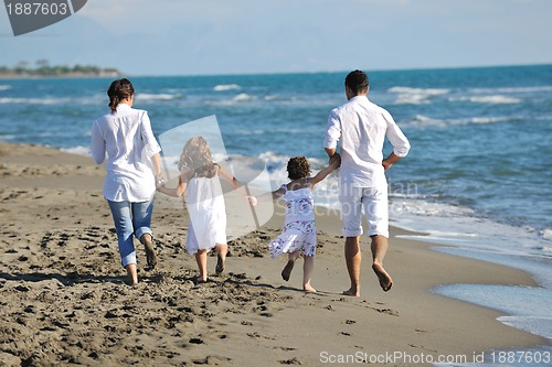 Image of happy young  family have fun on beach
