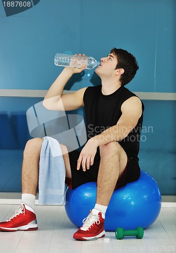 Image of man drink water at fitness workout