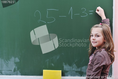 Image of happy school girl on math classes