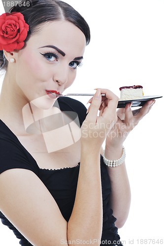 Image of beautiful young woman eat sweet cake