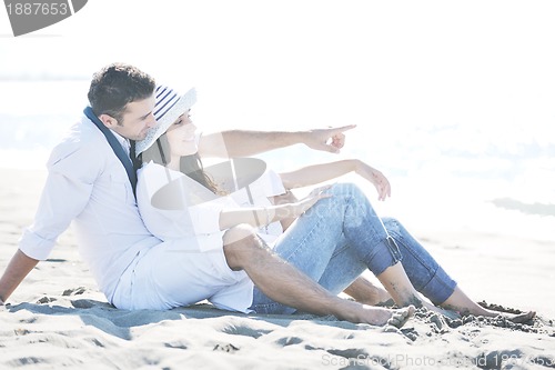 Image of happy young couple have fun at beautiful beach