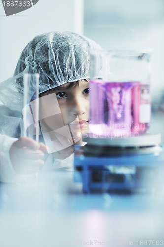 Image of little child scientist in lab