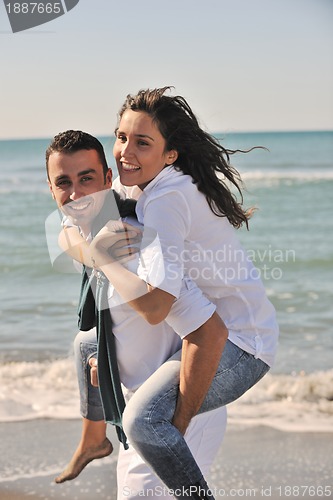 Image of happy young couple have fun at beautiful beach