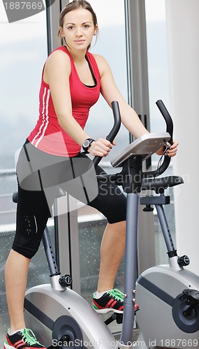 Image of woman workout  in fitness club on running track 