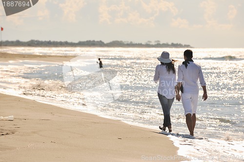Image of happy young couple have fun at beautiful beach