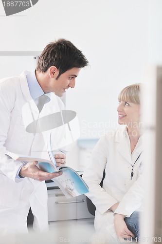 Image of science people in bright lab