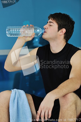 Image of man drink water at fitness workout 