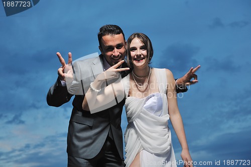 Image of romantic beach wedding at sunset