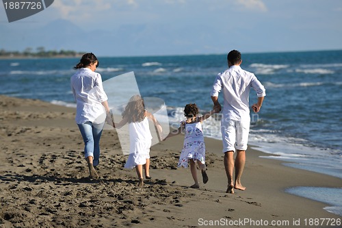 Image of happy young  family have fun on beach