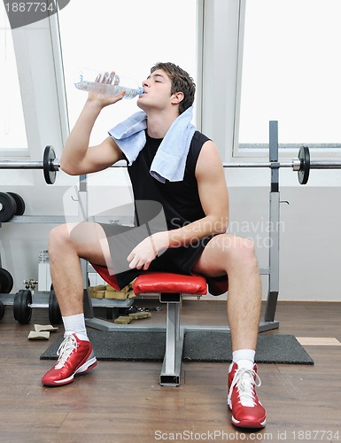 Image of man drink water at fitness workout 