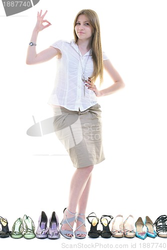 Image of pretty young woman with buying shoes addiction, isolated on whit