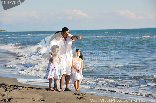 Image of happy young  family have fun on beach