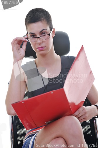 Image of brunette female  model posing on business chair