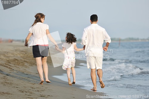 Image of happy young family have fun on beach