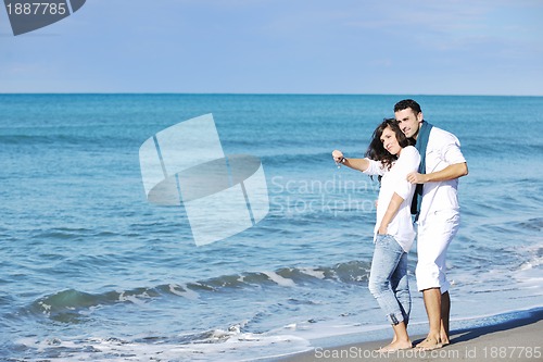 Image of happy young couple have fun at beautiful beach