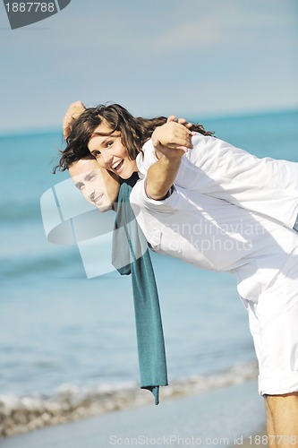 Image of happy young couple have fun at beautiful beach