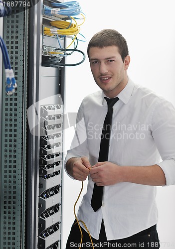 Image of young it engeneer in datacenter server room