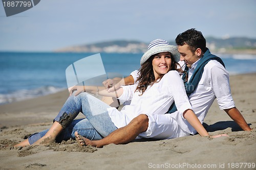 Image of happy young couple have fun at beautiful beach
