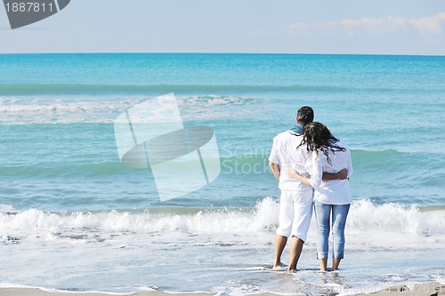 Image of happy young couple have fun at beautiful beach