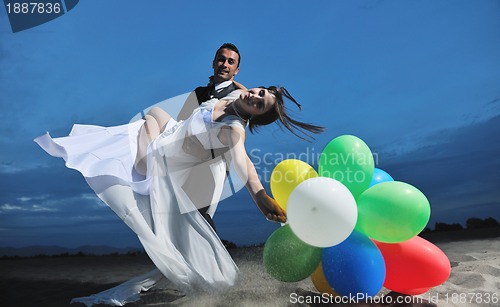 Image of romantic beach wedding at sunset