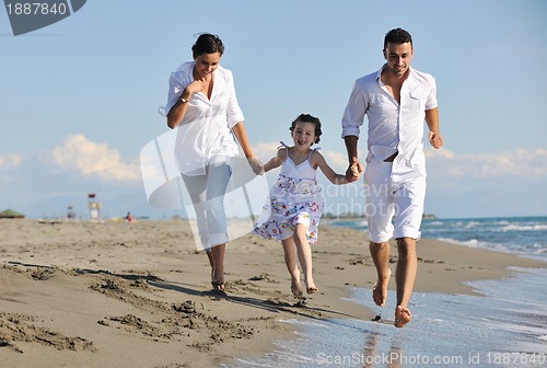 Image of happy young  family have fun on beach