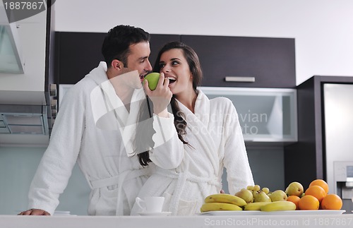 Image of young couple have fun in modern kitchen
