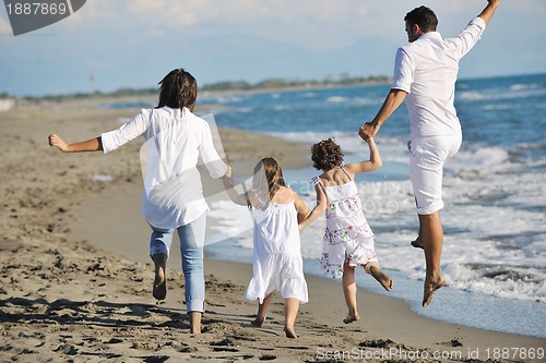 Image of happy young  family have fun on beach