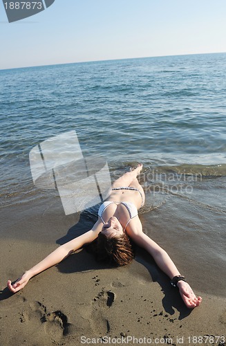 Image of young woman relax  on beach