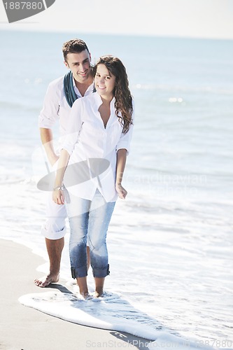 Image of happy young couple have fun at beautiful beach