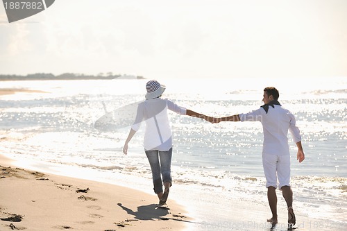 Image of happy young couple have fun at beautiful beach