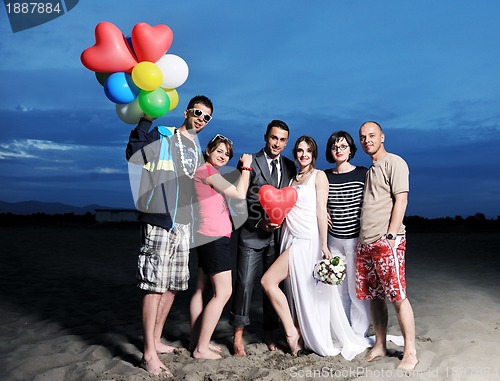 Image of happy young  people group have fun on beach