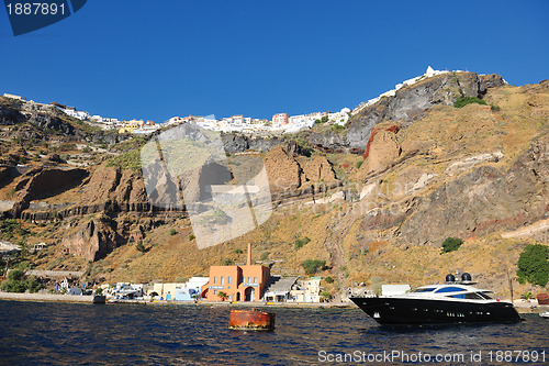 Image of santorini island coast with luxury yacht