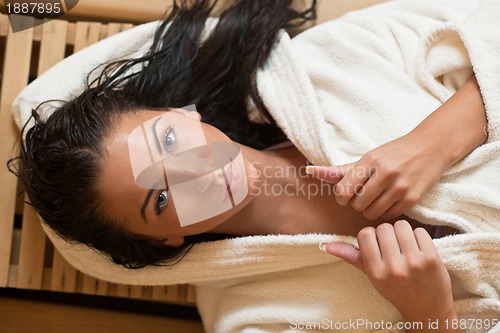 Image of Young woman take a steam bath