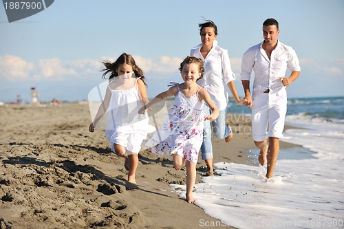 Image of happy young  family have fun on beach