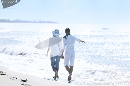 Image of happy young couple have fun at beautiful beach