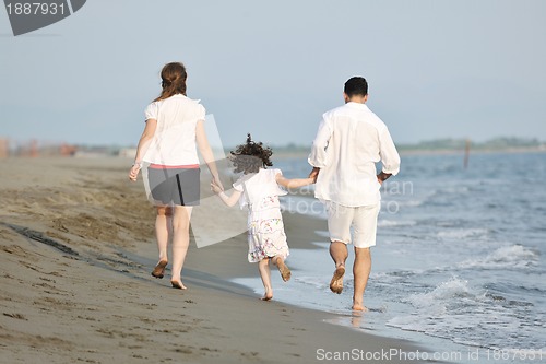 Image of happy young family have fun on beach