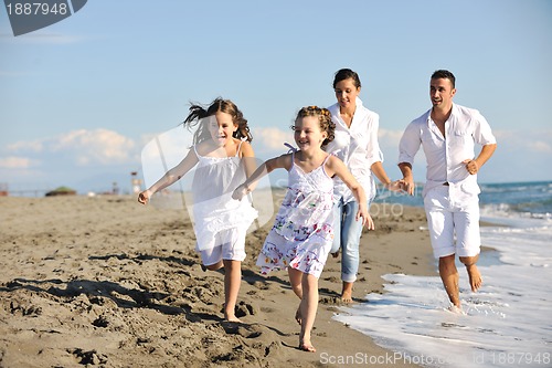 Image of happy young  family have fun on beach