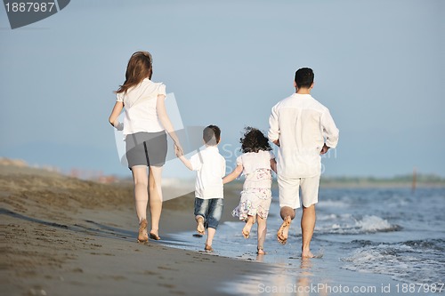 Image of happy young family have fun on beach