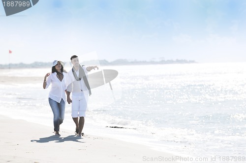 Image of happy young couple have fun at beautiful beach