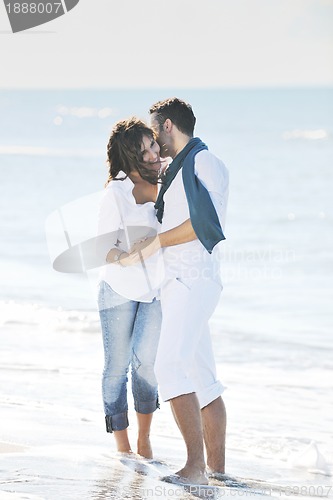 Image of happy young couple have fun at beautiful beach