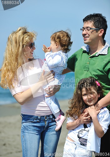 Image of happy young family have fun on beach