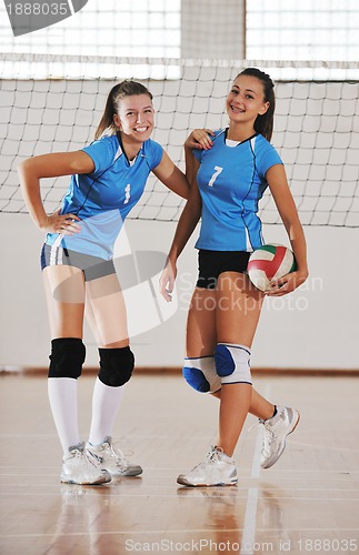 Image of girls playing volleyball indoor game