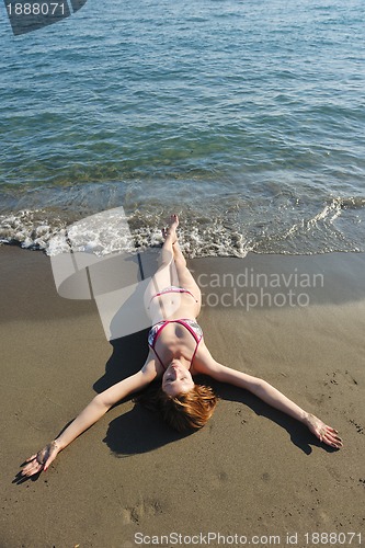 Image of young woman relax  on beach