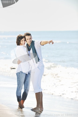 Image of happy young couple have fun at beautiful beach